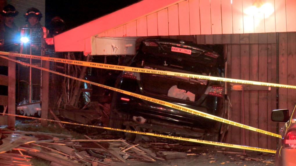 A photo of the damaged home and car